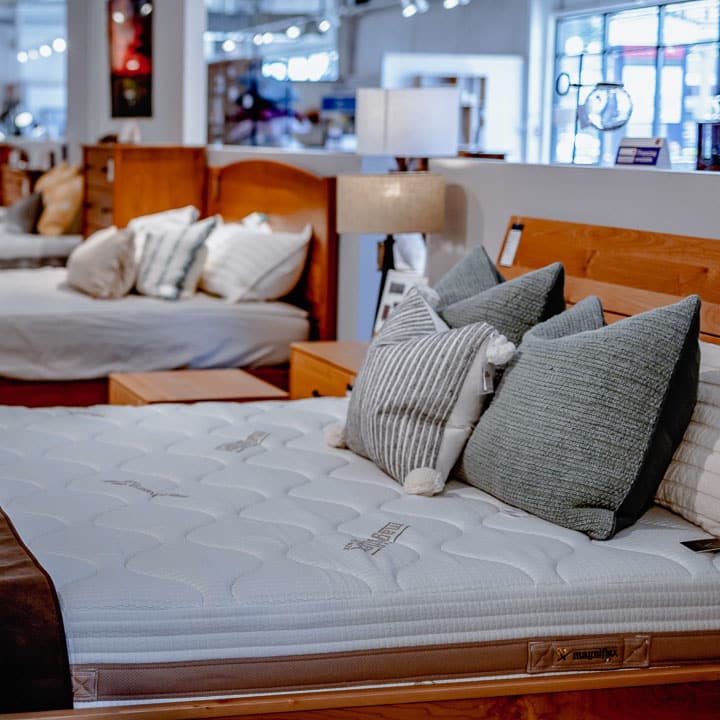 Bedroom furniture display with solid wood bed and dresser at West Avenue Furniture in Eugene, Oregon